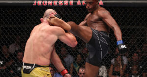 Jamahal Hill High left kick blocked by Glover Teixeira 