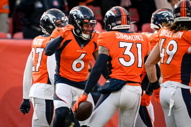 DENVER, CO – DECEMBER 18: Justin Simmons (31) of the Denver Broncos celebrates his interception of a pass thrown by Colt McCoy (12) of the Arizona Cardinals with P.J. Locke (6) during the first quarter at Empower Field at Mile High in Denver on Sunday, December 18, 2022. (Photo by AAron Ontiveroz/The Denver Post)