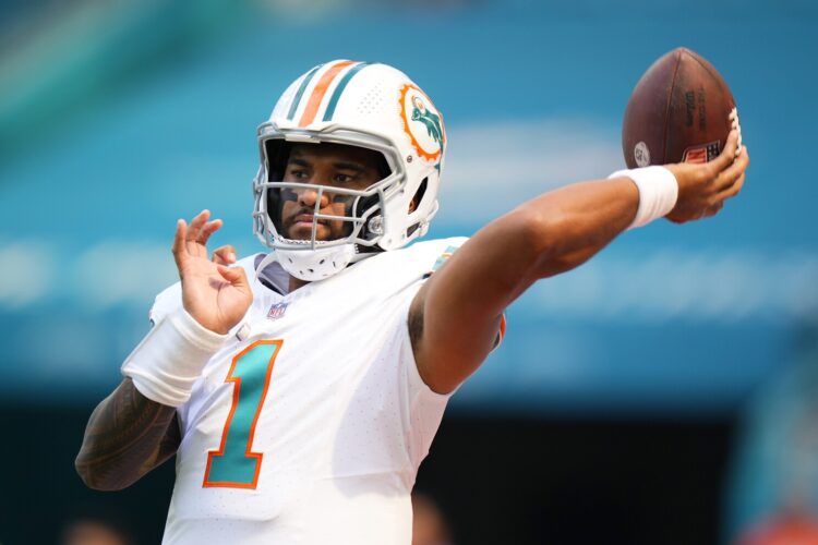 MIAMI GARDENS, FLORIDA - OCTOBER 29: Tua Tagovailoa #1 of the Miami Dolphins warms up prior to a game against the New England Patriots at Hard Rock Stadium on October 29, 2023 in Miami Gardens, Florida. (Photo by Rich Storry/Getty Images)