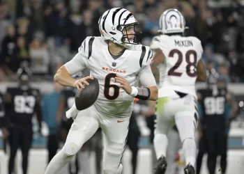 Cincinnati Bengals quarterback Jake Browning (6) looks to pass the football during the first half of an NFL football game against the Jacksonville Jaguars, Monday, Dec. 4, 2023, in Jacksonville, Fla. (AP Photo/Phelan M. Ebenhack)