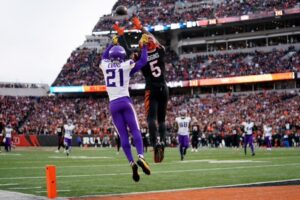 Bengals Tee Higgins makes a leaping catch against the Vikings for a touchdown. 